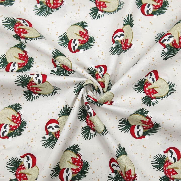 Actual product image Stoffrestposten Cotton - Christmas sloth on cream - Minimum quantity: 1 metre