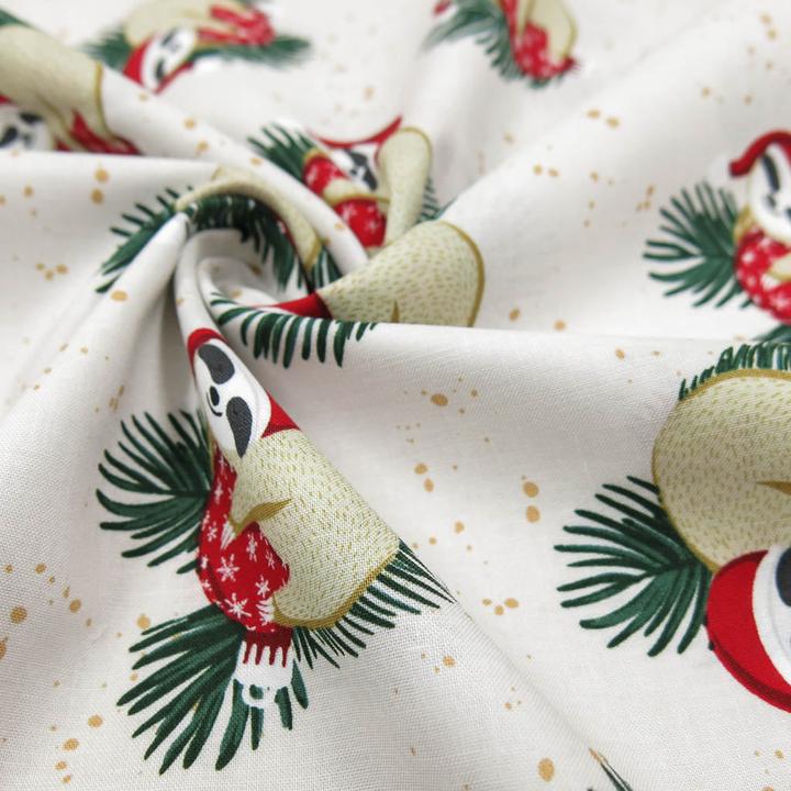Actual product image Stoffrestposten Cotton - Christmas sloth on cream - Minimum quantity: 1 metre