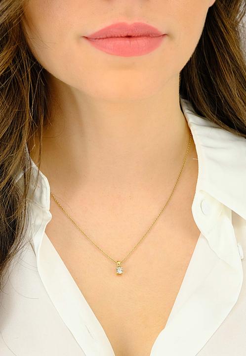 Image du produit Muau Pendentif (Or jaune, Or blanc, en or rose ou tout simplement en argent. Discret, mais qui attire le regard, l'un de nos bijoux préférés de la boutique de bijoux en ligne le pendentif 4 poignées serti de diamants 0.40ct. or jaune 750 dans la couleur or jaune. Bijoux)