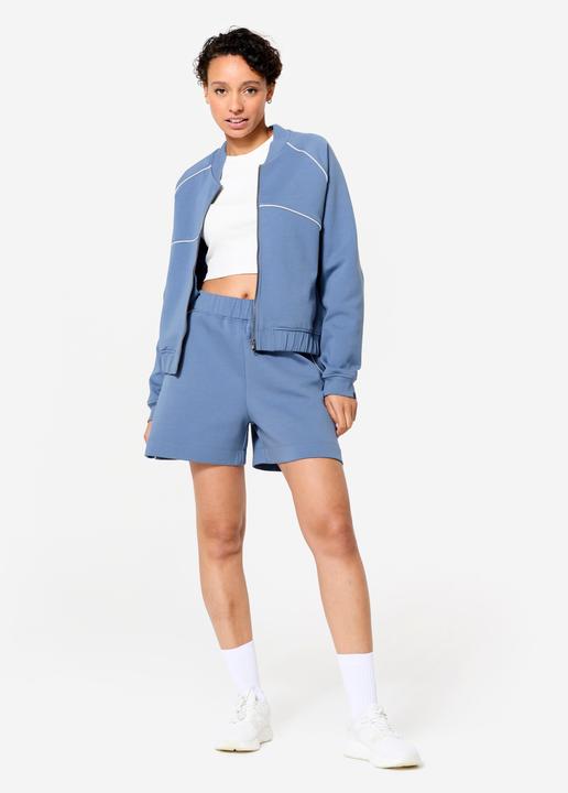 Image du produit Domyos Veste bombers zipée femme, bleu avec piping blanc. (XL)