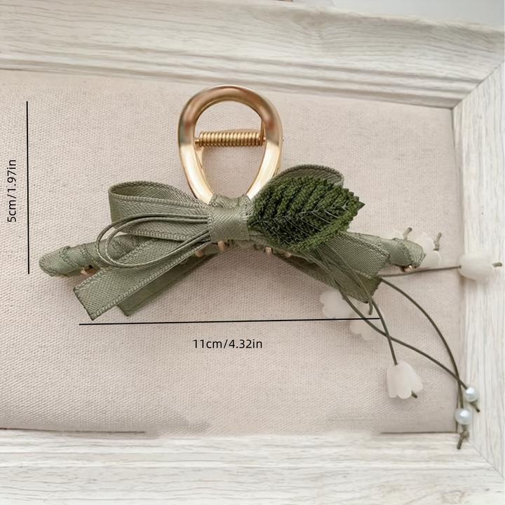 Actual product image Activity Board 1 Stück Elegante französische Maiglöckchen-Haarspange mit Quaste ist eine schicke Spange (1 pcs.)