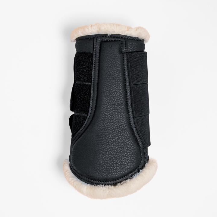 Image du produit Fouganza Guêtres 500 fermées dressage fourrure d'agneau synthétique cheval noir