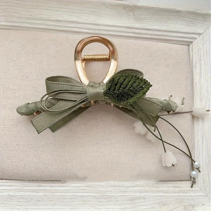 Actual product image Activity Board 1 Stück Elegante französische Maiglöckchen-Haarspange mit Quaste ist eine schicke Spange (1 pcs.)