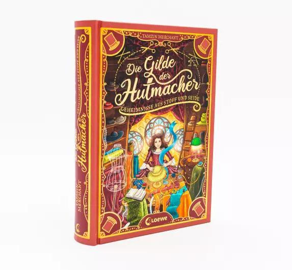 Actual product image Die Gilde der Hutmacher (Die magischen Gilden, Band 1) - Geheimnisse aus Stoff und Seide (German, Tamzin Merchant, Paola Escobar, Nadine Mannchen, 2022)