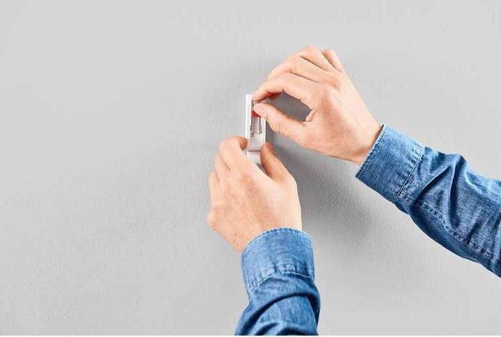 Actual product image tesa Adhesive nail for wallpaper & plaster, ideal for WLAN routers, height and side-adjustable